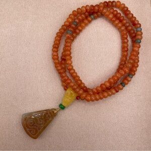 Vibrant Orange Jade Necklace with Intricate Design